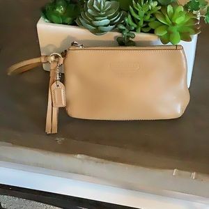 Leather Coach wristlet. Camel colored, zipper works and no stains inside or out.
